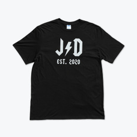 A black t-shirt with white lettering that says "JD" with a lightning bolt in between the letters and "established in 2020".